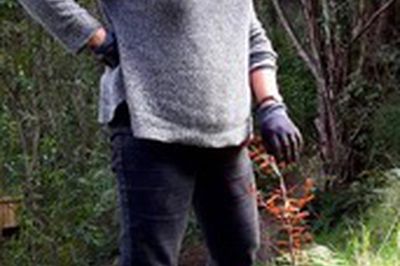 Cynthia Smith with a kauri seedling